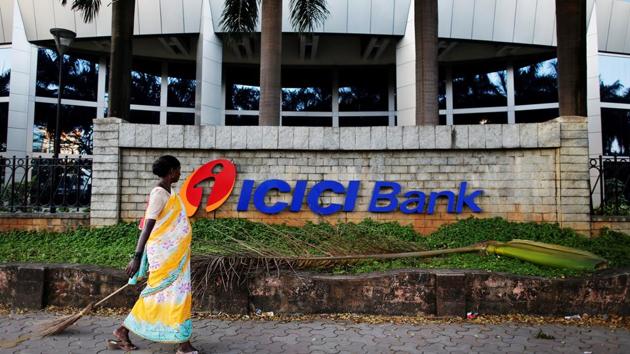 FILE PHOTO: A municipal worker walks past a logo of ICICI Bank at its headquarters in Mumbai October 25, 2013. REUTERS/Danish Siddiqui/File Photo GLOBAL BUSINESS WEEK AHEAD SEARCH GLOBAL BUSINESS 29 JAN FOR ALL IMAGES(REUTERS File Photo)