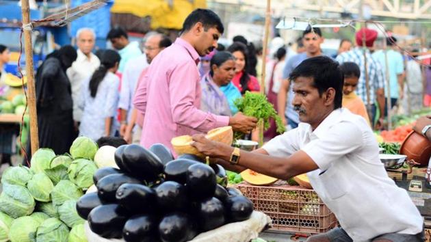 Selling vegetables at a market near Vishranthwadi, Alandi road, Ghogare married, raised a family with his wife Sushila Ghogare, who is also differently-abled, and educated both his sons. (HT Photo) Selling vegetables at a market near Vishranthwadi, Alandi road, Ghogare married, raised a family with his wife Sushila Ghogare, who is also differently-abled, and educated both his sons. (HT Photo)