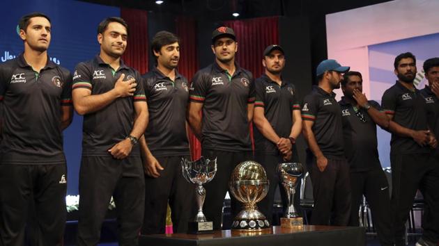 Afghanistan cricket team players stand with trophies after winning 2019 ICC World Cup qualifiers. (AP)
