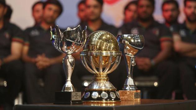 The ICC World Cup qualifier trophies placed in front of the cricketers. (AP)