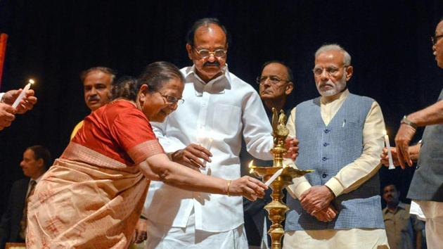 Lok Sabha Speaker Sumitra Mahajan lights a lamp as Vice President Venkaiah Naidu, Finance Minister Arun Jaitley and Prime Minister Narendra Modi look on, during the farewell function for Rajya Sabha members in New Delhi on Tuesday. (PTI) Lok Sabha Speaker Sumitra Mahajan lights a lamp as Vice President Venkaiah Naidu, Finance Minister Arun Jaitley and Prime Minister Narendra Modi look on, during the farewell function for Rajya Sabha members in New Delhi on Tuesday. (PTI)