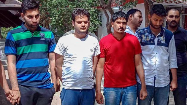 Ajay Kumar, Gaurav, Sonu Singh and Param allegedly involved in online hacking of Staff Selection Commission (SSC) exam arrested in a joint operation by Uttar Pradesh Special Task Force (STF) and the Delhi Police in New Delhi on Wednesday.(PTI Photo)