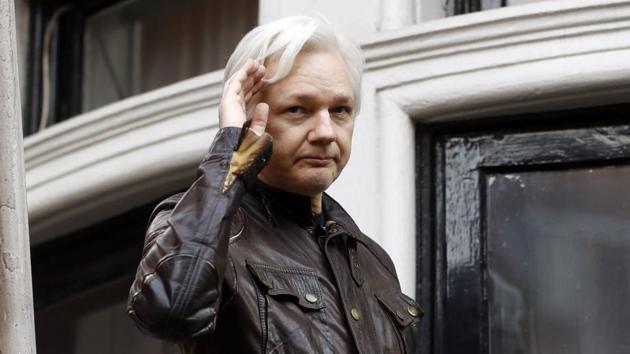 FILE - In this May 19, 2017 file photo, WikiLeaks founder Julian Assange greets supporters from a balcony of the Ecuadorian embassy in London.(AP)