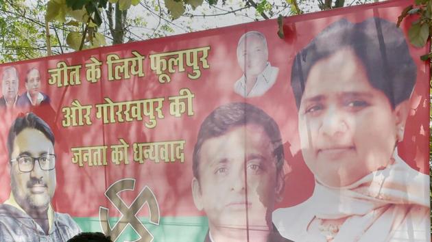 A poster is seen with BSP supremo Mayawati and SP chief Akhilesh Yadav, celebrating their win in Phulpur and Gorakhpur bypoll elections, outside SP office in Lucknow. (PTI Phto) A poster is seen with BSP supremo Mayawati and SP chief Akhilesh Yadav, celebrating their win in Phulpur and Gorakhpur bypoll elections, outside SP office in Lucknow. (PTI Phto)