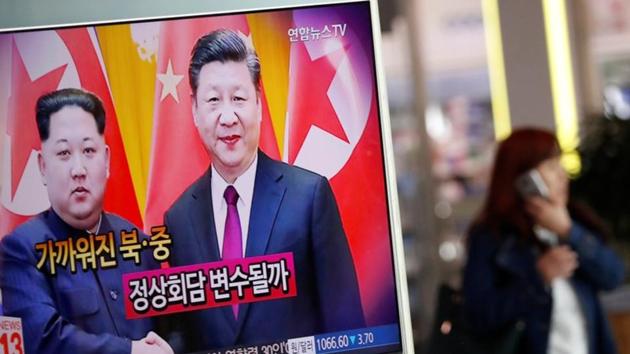 A woman walks past a TV broadcasting a news report on a meeting between North Korean leader Kim Jong Un and Chinese President Xi Jinping in Beijing, in Seoul, South Korea. (Reuters Photo) A woman walks past a TV broadcasting a news report on a meeting between North Korean leader Kim Jong Un and Chinese President Xi Jinping in Beijing, in Seoul, South Korea. (Reuters Photo)