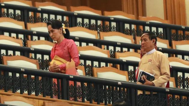 Myanmar’s state counsellor Aung San Suu Kyi and vice president Win Myint attend a parliament session to elect the country’s new president, in Naypyitaw, Myanmar on Wednesday.(Reuters)