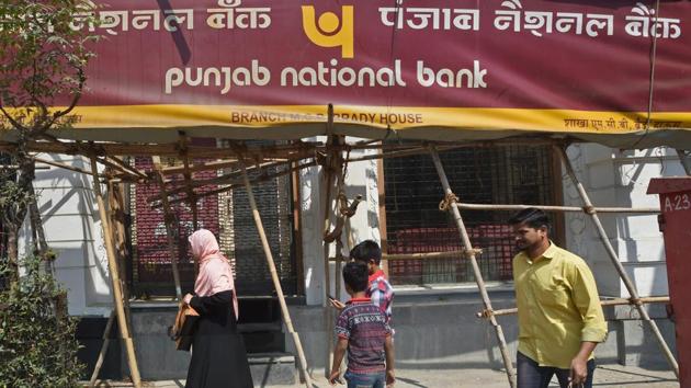 People walk past as CBI team seals Punjab National Bank’s South Mumbai branch at Brady House in Mumbai. (PTI File Photo) People walk past as CBI team seals Punjab National Bank’s South Mumbai branch at Brady House in Mumbai. (PTI File Photo)