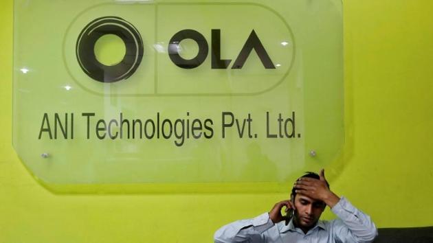An employee speaks over his phone as he sits at the front desk inside the office of Ola cab service in Gurgaon in April 20, 2016. (Reuters File) An employee speaks over his phone as he sits at the front desk inside the office of Ola cab service in Gurgaon in April 20, 2016. (Reuters File)