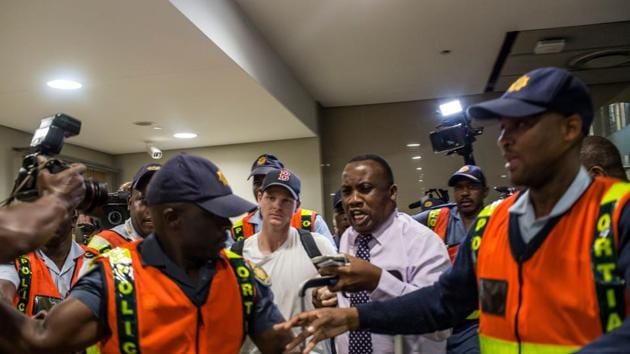 Former captain Steve Smith of the Australian Cricket Team departs at O R Tambo International Airport after being caught cheating in the Sunfoil Test Series between Australia and South Africa. Disgraced Australia skipper Steve Smith and senior batsman David Warner were banned from cricket for 12 months over a cheating scandal that has rocked the sport and dragged their side's reputation through the mud. (AFP)
