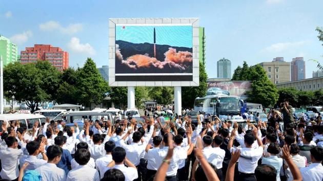 People watch a huge screen showing the test launch of intercontinental ballistic missile Hwasong-14 in this undated photo released by North Korea's Korean Central News Agency (KCNA), July 5, 2017.(Reuters File Photo)