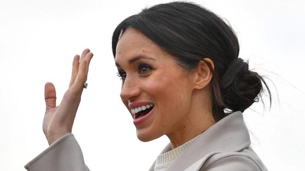 Prince Harry's fiancee, Meghan Markle waves to well-wishers after a visit to the iconic tourist attraction, Titanic Belfast, in Belfast. (AFP) Prince Harry's fiancee, Meghan Markle waves to well-wishers after a visit to the iconic tourist attraction, Titanic Belfast, in Belfast. (AFP)