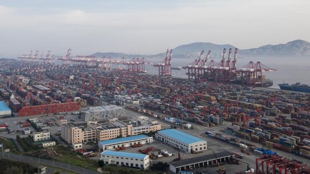 A container ship is docked at the Yangshan port in Shanghai on March 29. (AP Photo) A container ship is docked at the Yangshan port in Shanghai on March 29. (AP Photo)