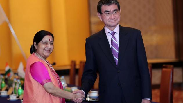 Japan's Foreign Minister Taro Kono (R) shakes hands with his Indian counterpart Sushma Swaraj during their meeting in Tokyo on March 29, 2018. (AFP) Japan's Foreign Minister Taro Kono (R) shakes hands with his Indian counterpart Sushma Swaraj during their meeting in Tokyo on March 29, 2018. (AFP)
