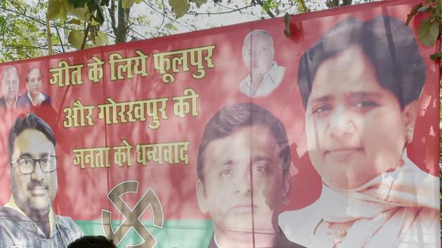 A poster is seen with BSP supremo Mayawati and SP chief Akhilesh Yadav, celebrating their win in Phulpur and Gorakhpur bypoll elections, outside SP office in Lucknow. (PTI File Photo) A poster is seen with BSP supremo Mayawati and SP chief Akhilesh Yadav, celebrating their win in Phulpur and Gorakhpur bypoll elections, outside SP office in Lucknow. (PTI File Photo)
