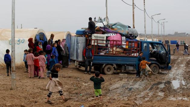 A few days after deciding to leave, neighbours and relatives came to help them load their belongings onto the small truck that would start the next chapter of their lives. (Khalid Al-Mousily / REUTERS) A few days after deciding to leave, neighbours and relatives came to help them load their belongings onto the small truck that would start the next chapter of their lives. (Khalid Al-Mousily / REUTERS)