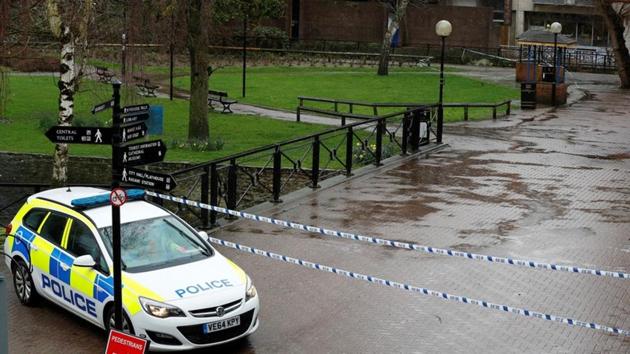 A police vehicle is parked next to cordon tape close to where former Russian intelligence officer Sergei Skripal and his daughter Yulia were found poisoned, in Salisbury, Britain, on Wednesday.(Reuters photo)