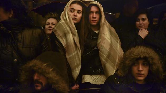 Devotees protect themselves from the rain during a procession of the “Santa Veracruz” brotherhood, during the Holy Week in Calahorra, northern Spain. Hundreds of processions take place throughout Spain during the Easter Holy Week. (Alvaro Barrientos / AP) Devotees protect themselves from the rain during a procession of the “Santa Veracruz” brotherhood, during the Holy Week in Calahorra, northern Spain. Hundreds of processions take place throughout Spain during the Easter Holy Week. (Alvaro Barrientos / AP)
