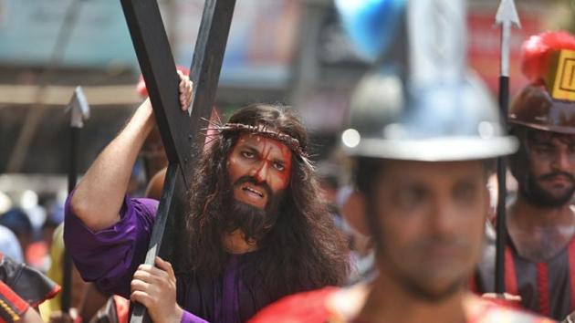 A procession from Sacred Heart Church, Santacruz West to St. Charles Convent, Vakola in Mumbai re-enacts Jesus Christ’s crucifixion on the occasion of Good Friday. (Satyabrat Tripathy / HT Photo)