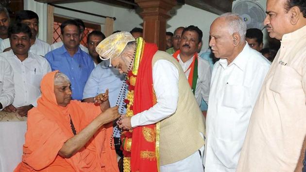 Bharatiya Janata Party president Amit Shah visited Suttur math Seer Sri Shivaratri Deshikendra Swamiji during his two-day tour to Karnataka, ahead of Karnataka Assembly elections. Shah on Friday said if his party came to power in Karnataka, it would catch hold of murderers of his party activists even if they hide in the abyss. (PTI)