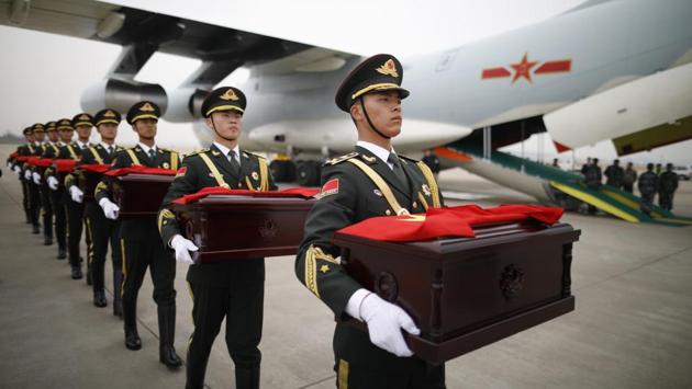 Chinese soldiers carry caskets containing the remains of Chinese soldiers who died in the Korean War, during the handover ceremony at the Incheon International Airport in Incheon, South Korea. (Kim Hong-Ji / Pool Photo via AP)
