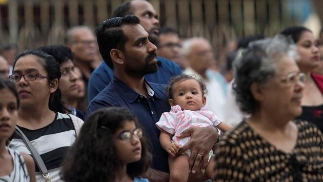 Devotees praying at Mount Carmel Church in Bandra. (Satish Bate/HT Photo)