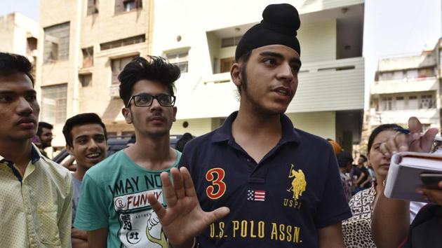 Students standing outside Vickey Bhaiya's Institute at Rajendra Nagar in New Delhi on Thursday.(Sanchit Khanna/HT Photo)