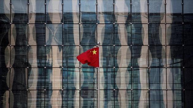 A Chinese national flag flutters at the headquarters of a commercial bank on a financial street in central Beijing. (REUTERS FILE) A Chinese national flag flutters at the headquarters of a commercial bank on a financial street in central Beijing. (REUTERS FILE)