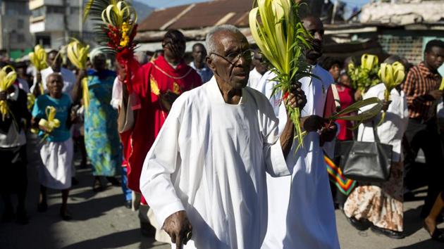 People hold palm fronds during a Palm Sunday procession before Mass at the Cathedral of Port-au-Prince, Haiti. Once blessed, palm leaves used on this day are not discarded and incinerated instead for use in the next year’s Ash Wednesday rituals. (Dieu Nalio Chery / AP) People hold palm fronds during a Palm Sunday procession before Mass at the Cathedral of Port-au-Prince, Haiti. Once blessed, palm leaves used on this day are not discarded and incinerated instead for use in the next year’s Ash Wednesday rituals. (Dieu Nalio Chery / AP)