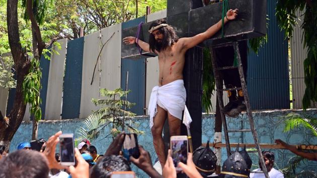 The faithful record the way of the cross at Don Bosco church in Yerawada,  on March 30. (SHANKAR NARAYAN/HT PHOTO) 