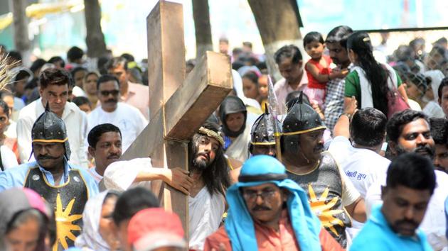 Don Bosco church members enact the part where Jesus carries the cross. in the city on March 30. (SHANKAR NARAYAN/HT PHOTO) 