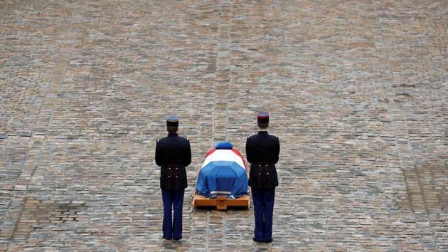 French Republican guards stand in front of the flag-draped coffin of Gendarmerie officer Colonel Arnaud Beltrame, who was killed by an Islamist militant after taking the place of a female hostage during a supermarket siege in Trebes, during a national ceremony at the Hotel des Invalides in Paris, France. (Christian Hartmann / REUTERS)