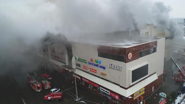 At least 64 people, 41 of them children, died in a fire at the Winter Cherry mall in the Siberian city of Kemerovo. Relatives say dozens are still missing. (Russian Emergencies Ministry / REUTERS)