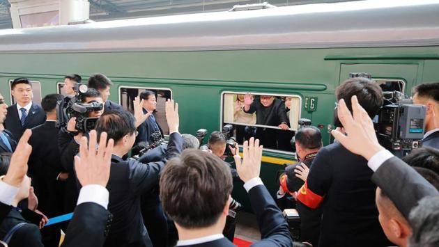 North Korean leader Kim Jong Un waves from a train, as he departs on an unofficial visit to China, in Pyongyang, North Korea. (KCNA / REUTERS)