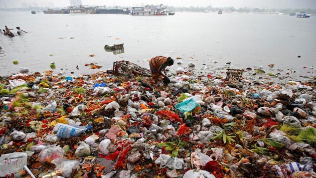 A woman collects items thrown by devotees as religious offerings in the river Ganga, after the celebrations on the final day of Navratri in Kolkata, West Bengal. (Rupak De Chowdhuri / REUTERS) A woman collects items thrown by devotees as religious offerings in the river Ganga, after the celebrations on the final day of Navratri in Kolkata, West Bengal. (Rupak De Chowdhuri / REUTERS)