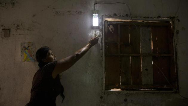 Guerra remembers life in Cachimbo as difficult, ugly and always dark. Just walking around town one risked falling. With the solar kits people can go to bed later, children can do their homework at night and the women can do chores in the home while men continue their labours. “Everything is easier now that there is illumination,” Guerra said. (Yael Martinez / Bloomberg)