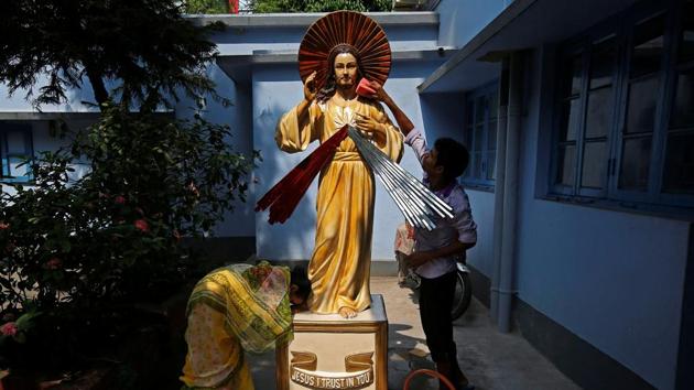 A woman prays in front of a statue of Jesus Christ as a man cleans it at a church, ahead of Good Friday celebrations, in Kolkata, India. (Rupak De Chowdhuri / REUTERS) A woman prays in front of a statue of Jesus Christ as a man cleans it at a church, ahead of Good Friday celebrations, in Kolkata, India. (Rupak De Chowdhuri / REUTERS)