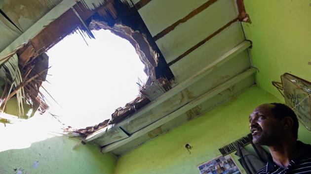 A man looking at a hole in a household ceiling caused by shrapnel from Yemeni rebel missiles that were intercepted over the Riyadh, Saudi Arabia. Saudi forces intercepted seven Yemeni missiles on March 25, on the eve of the third anniversary of the Saudi-led coalition's intervention in Yemen. (Fayez Nureldine / AFP)