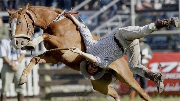 A gaucho is thrown off a wild horse during the “Criolla del Prado” rodeo during Easter Week in Montevideo, Uruguay. The traditional “jineteadas” have been a popular Holy Week tradition since 1925, and were named a national sport by Uruguayan lawmakers in 2006. (Matilde Campodonico / AP) A gaucho is thrown off a wild horse during the “Criolla del Prado” rodeo during Easter Week in Montevideo, Uruguay. The traditional “jineteadas” have been a popular Holy Week tradition since 1925, and were named a national sport by Uruguayan lawmakers in 2006. (Matilde Campodonico / AP)