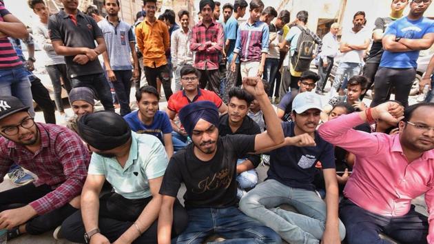Students sit in protest outside the CBSE office in New Delhi on Saturday.(Raj K Raj/HT Photo) Students sit in protest outside the CBSE office in New Delhi on Saturday.(Raj K Raj/HT Photo)