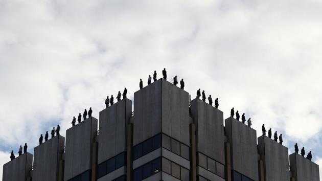 An art installation by US sculptor Mark Jenkins called 'Project 84', which aims to raise awareness of male suicide rates in the United Kingdom, is seen on the roof of a building in central London, Britain. (Hannah McKay / REUTERS)