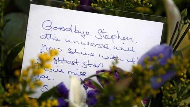 A floral tribute left outside Great St Marys Church, where the funeral of theoretical physicist Prof Stephen Hawking is being held, in Cambridge, Britain on March 31.(REUTERS)