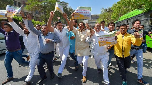 Congress workers hold placards and protest against the CBSE board exam paper leak outside CBSE headquarters in New Delhi. (Kamal Kishore / PTI) Congress workers hold placards and protest against the CBSE board exam paper leak outside CBSE headquarters in New Delhi. (Kamal Kishore / PTI)