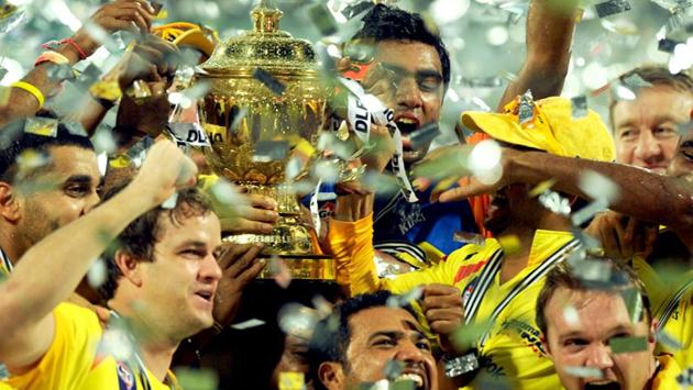 Chennai Super Kings celebrate with the trophy after winning the 2011 IPL final against Royal Challengers Bangalore. (AFP) 