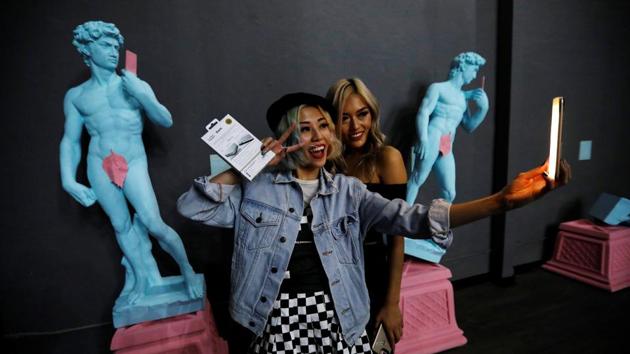 Guests take a selfie during a VIP preview ahead of the opening of The Museum of Selfies in Glendale, California. Regardless of one’s perception of the selfie sensation, the museum offers a highly-visual and educational experience for guests to post and initiate a discussion of the origin of selfies and their meanings. (Mario Anzuoni / REUTERS) Guests take a selfie during a VIP preview ahead of the opening of The Museum of Selfies in Glendale, California. Regardless of one’s perception of the selfie sensation, the museum offers a highly-visual and educational experience for guests to post and initiate a discussion of the origin of selfies and their meanings. (Mario Anzuoni / REUTERS)