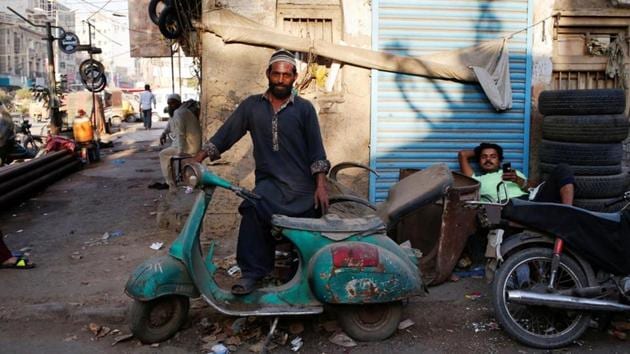 Shahzad stands with his abandoned Vespa scooter in Karachi. Few expect the tide to turn, with cheap motorbike ownership transforming the lives of many poor and lower working class people in the urbanising nation of 208 million people. (Akhtar Soomro / REUTERS) Shahzad stands with his abandoned Vespa scooter in Karachi. Few expect the tide to turn, with cheap motorbike ownership transforming the lives of many poor and lower working class people in the urbanising nation of 208 million people. (Akhtar Soomro / REUTERS)