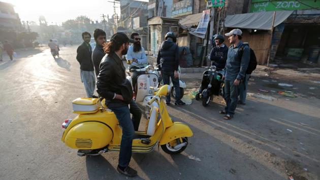 Over the past two decades, motorbike ownership rates have skyrocketed in Pakistan, but for the likes of Zubair Ahmad Nagra, who runs the Vespa club in Lahore, new and more fuel-efficient bikes hold little allure. He drives a Vespa, Italian for “wasp”, imported into Pakistan by his father in 1974. “It was the first motorized vehicle owned by my father,” Nagra said. “I’ve been fond of it ever since.” (Caren Firouz / REUTERS) Over the past two decades, motorbike ownership rates have skyrocketed in Pakistan, but for the likes of Zubair Ahmad Nagra, who runs the Vespa club in Lahore, new and more fuel-efficient bikes hold little allure. He drives a Vespa, Italian for “wasp”, imported into Pakistan by his father in 1974. “It was the first motorized vehicle owned by my father,” Nagra said. “I’ve been fond of it ever since.” (Caren Firouz / REUTERS)
