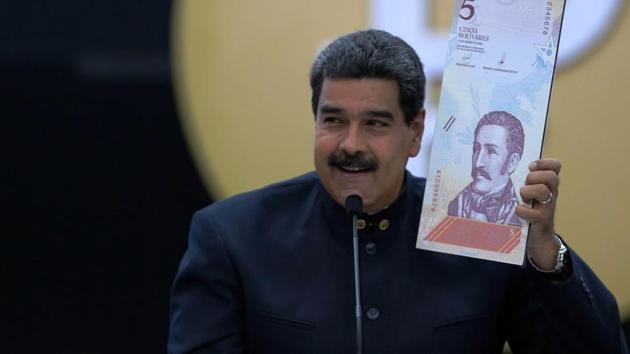 Handout photo released by the Venezuelan Presidency shows president Nicolas Maduro announce a new set of currency due to soaring inflation, on March 22, 2018.(AFP Photo)