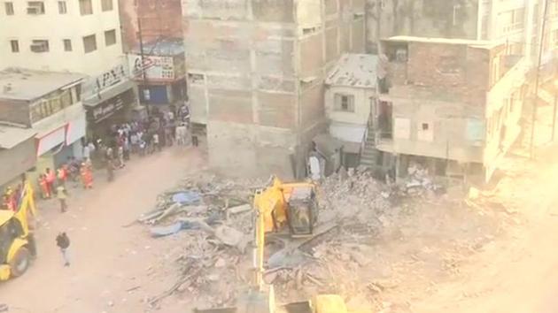 According to police, the 50-year-old building housed shops, hotel and a lodge.(ANI Photo)
