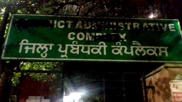 A smudged board at the district administrative complex in Bathinda.(HT Photo)