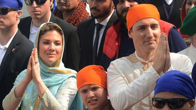 Canada Prime Minister Justin Trudeau (right) and his wife Sophie Gregoire (left) and son Xavier (centre) visit the Golden Temple in Amritsar on February 21.(AFP File)